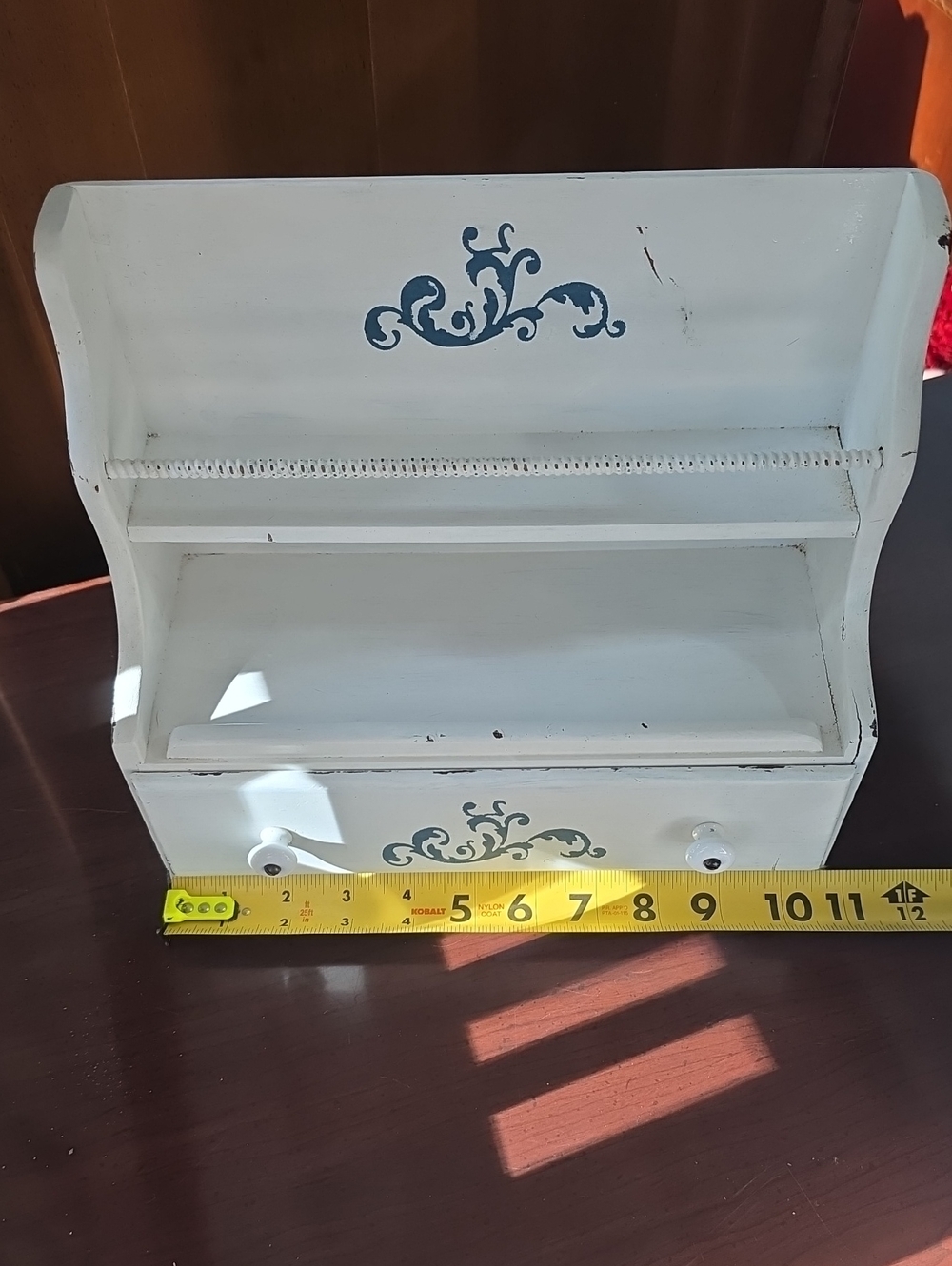 White Decorative Wooden Wall Shelf with Blue Scroll Accents